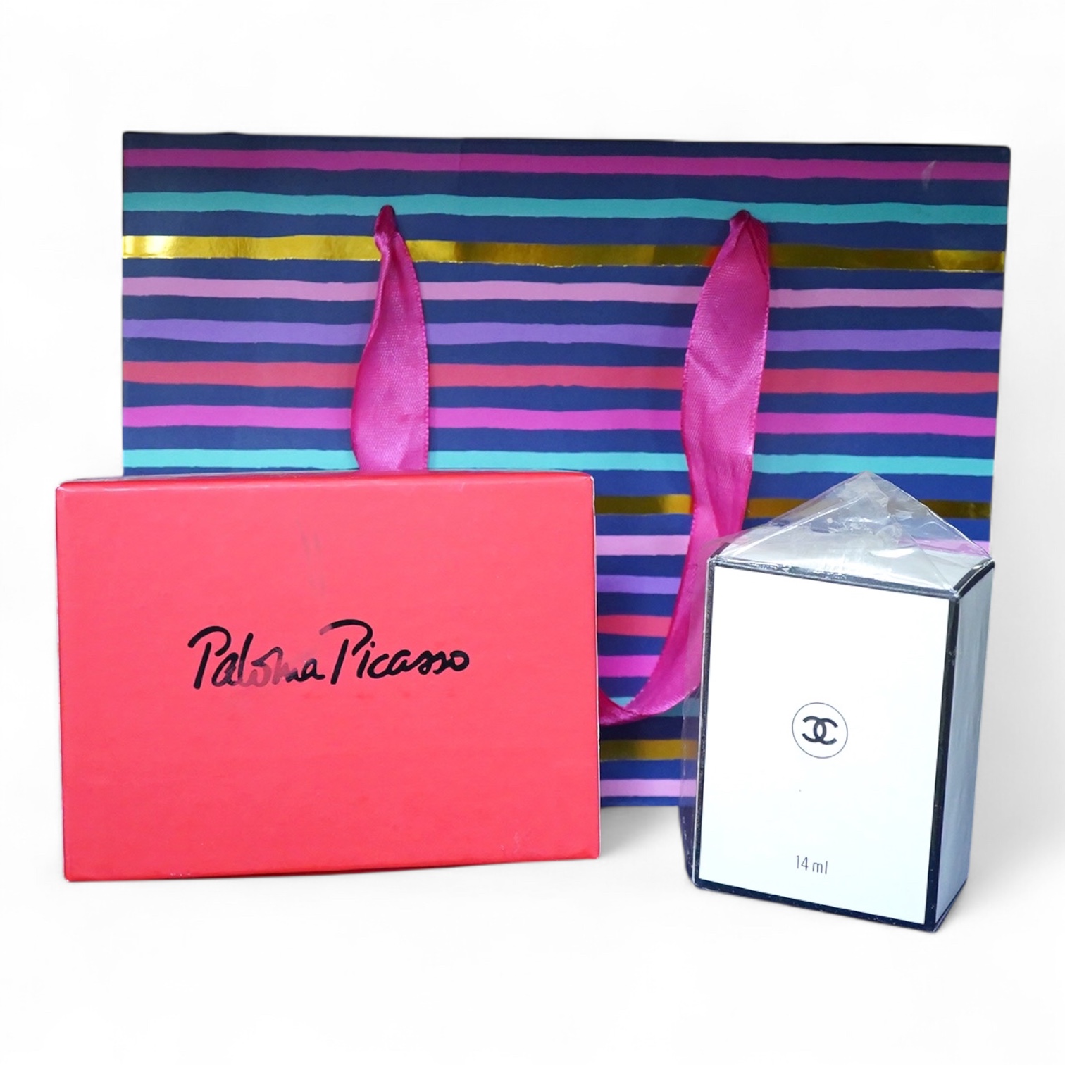 An unopened bottle of Chanel No.22 perfume, together with a boxed Paloma Picasso lipstick